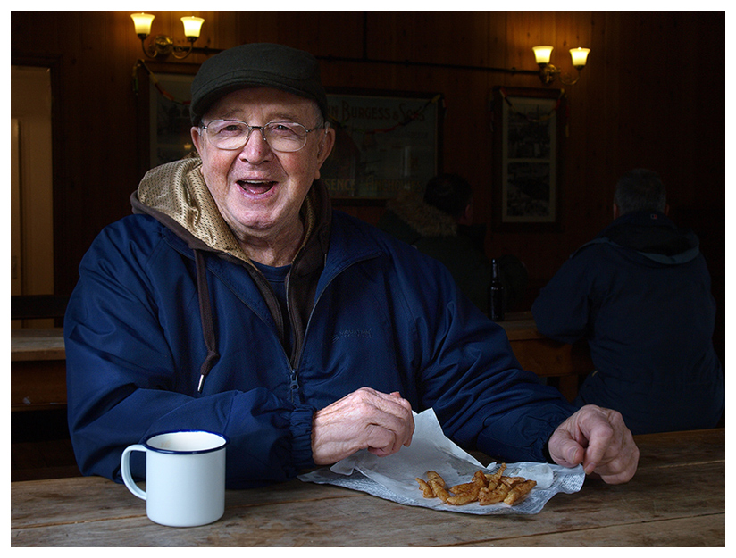 My Father, an avid angler, but these days not during the depths of winter, enjoying some Beamish chips that have been fried in beef dripping.  Unfortunately they only fry fish on a weekend, during the winter months.